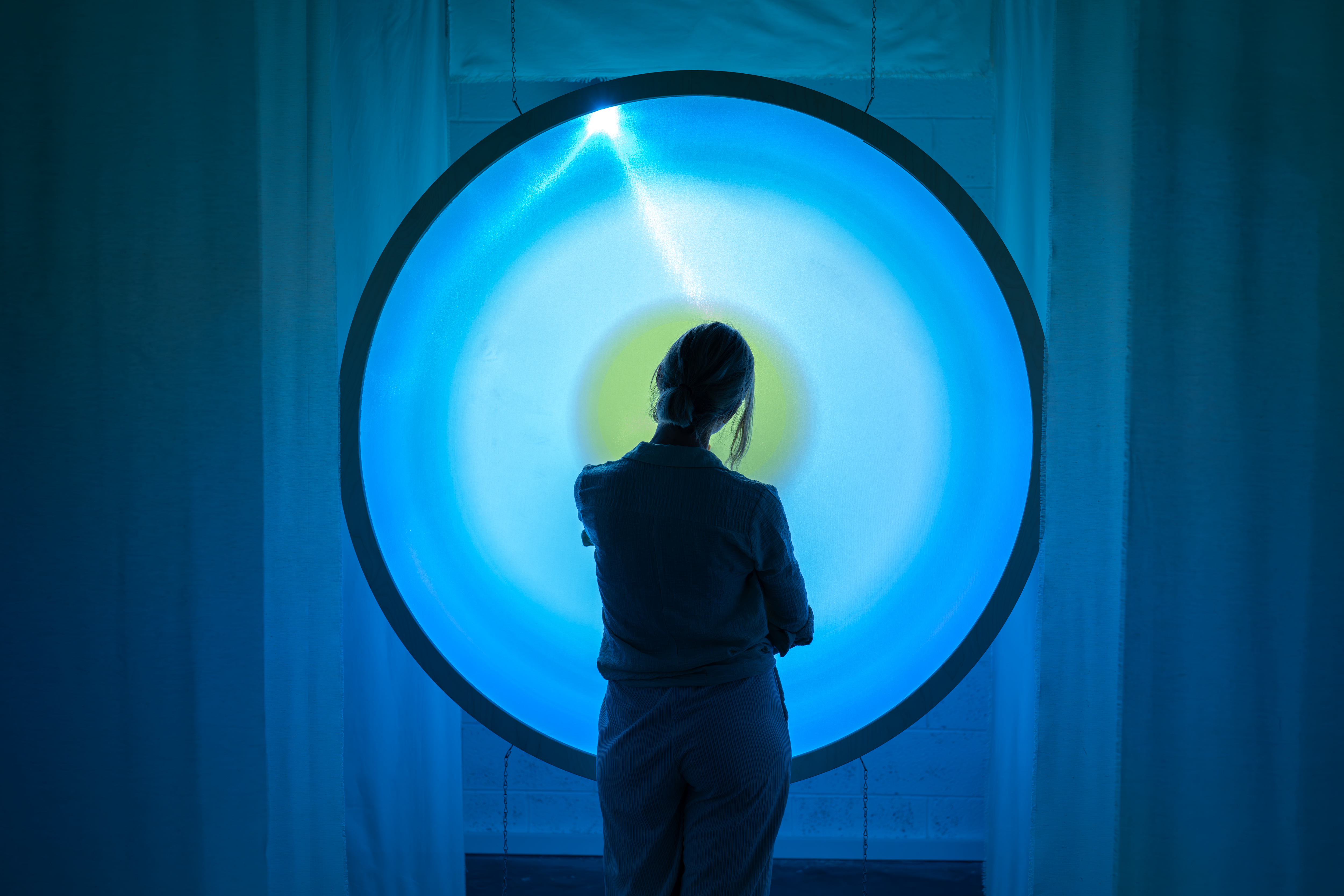 Participant interacting with Pulse Now installation